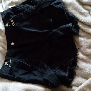 Black distressed jean shorts with overall straps